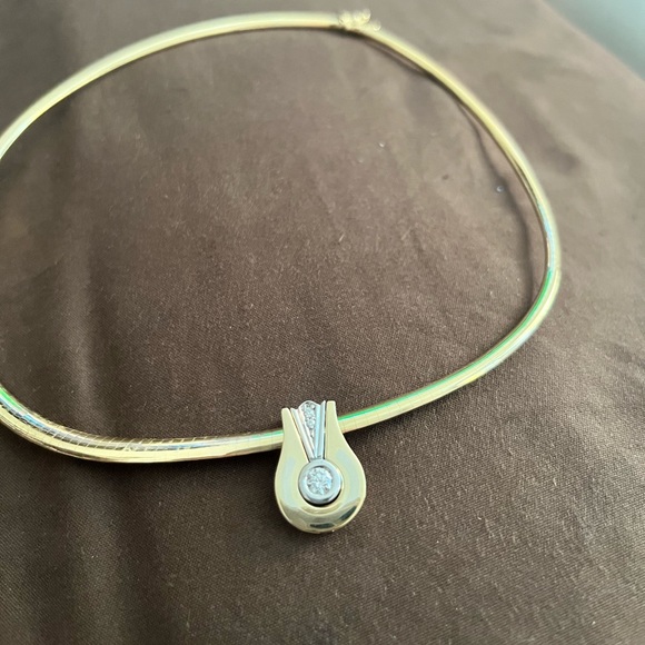 Jewelry - 14 karat omega with 1/2 carat diamond pendant with 2 small diamonds